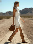 FJØRNA denim tassel mini dress for women, showcasing a stylish knee-length dress with tassel details and a fitted silhouette.