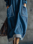 Blue corduroy midi dress by FJØRNA, casual dress with long sleeves and fitted waist, shown on a model.