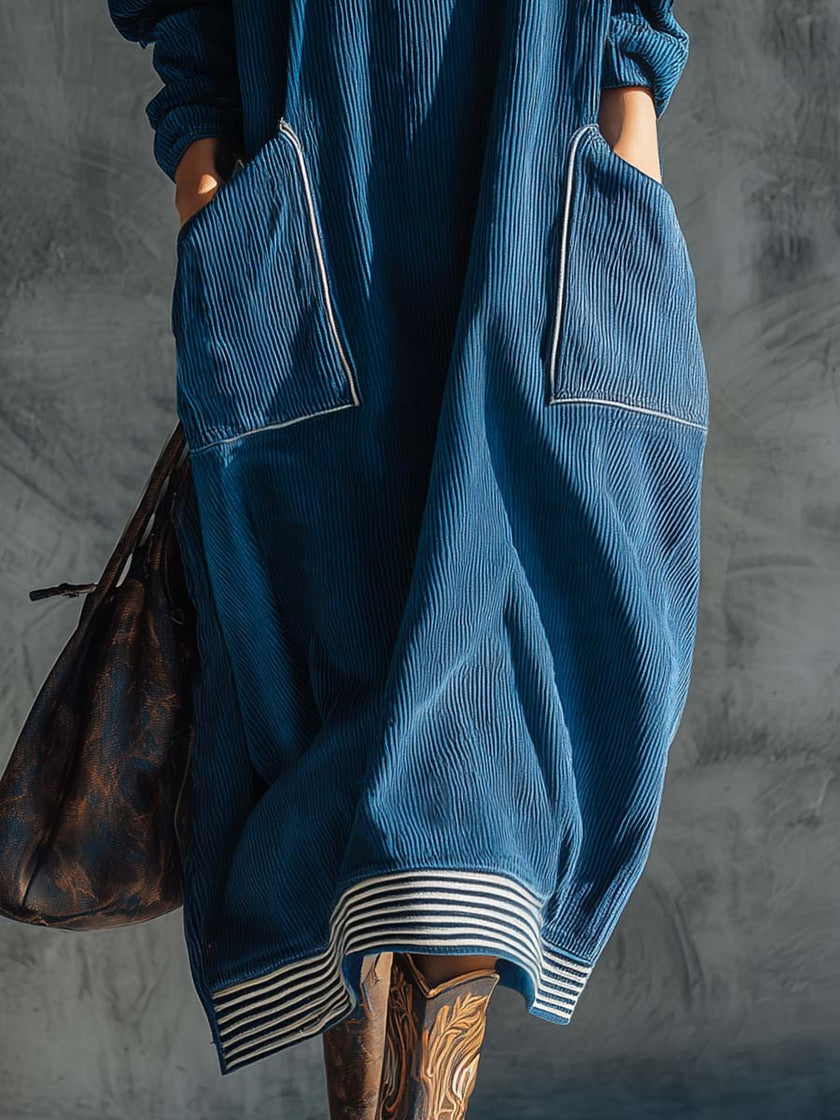 Blue corduroy midi dress by FJØRNA, casual dress with long sleeves and fitted waist, shown on a model.