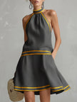 FJØRNA linen sleeveless mini dress with elegant design, perfect for evening wear, featuring a stylish and sophisticated look.