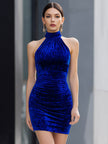 Royal blue velvet halter bodycon mini dress by FJØRNA, featuring a sleek cocktail dress design with fitted silhouette and halter neckline.