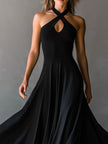 Black FJØRNA halter neck midi dress, elegant evening dress with sleeveless design and fitted silhouette, suitable for formal occasions.