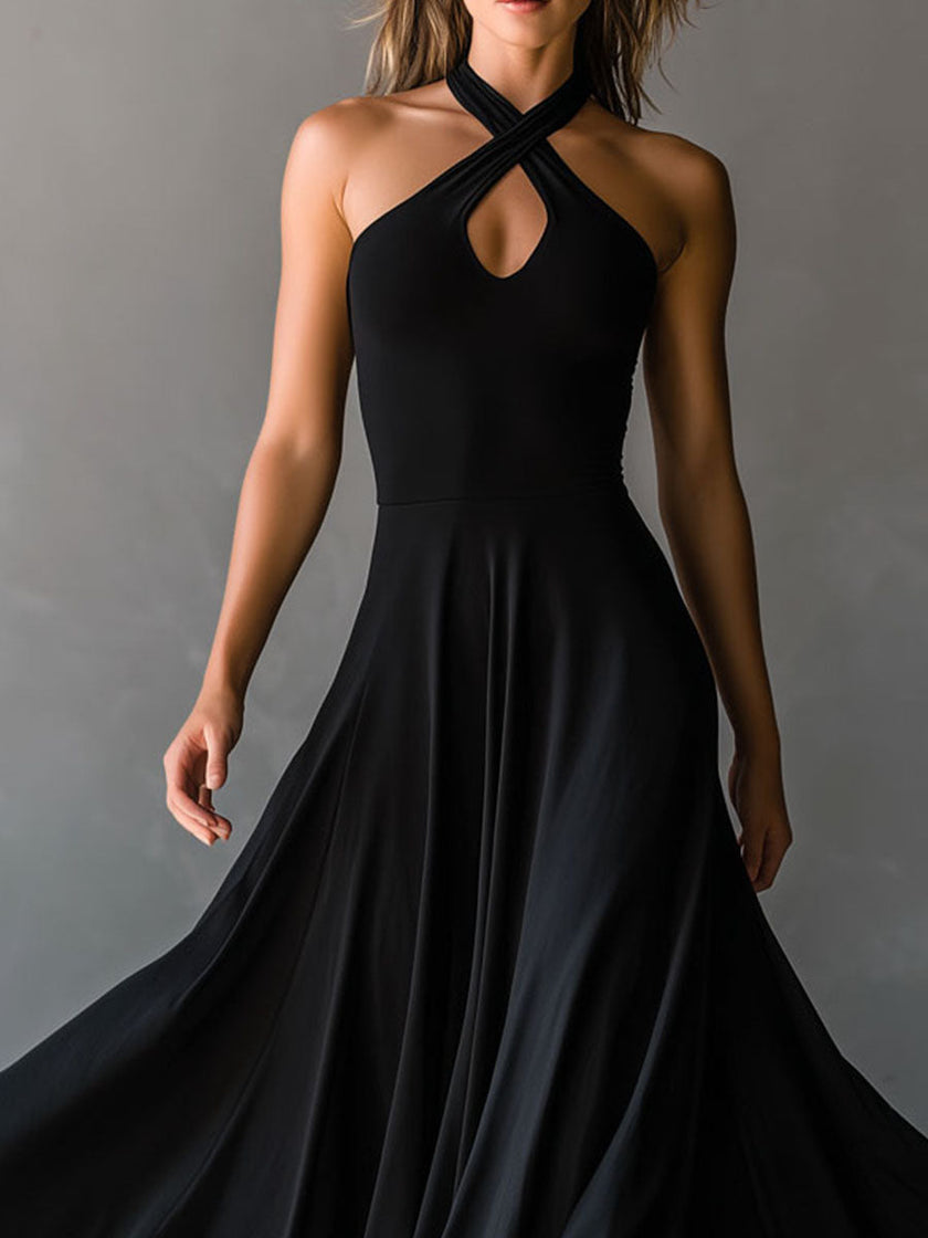 Black FJØRNA halter neck midi dress, elegant evening dress with sleeveless design and fitted silhouette, suitable for formal occasions.