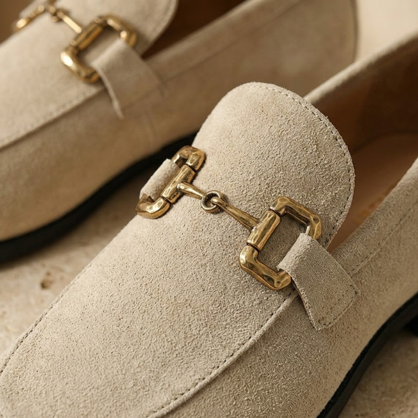 Men's brown suede slip-on loafers by FJØRNA, showcasing smooth suede material and sleek, casual shoe design.