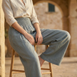 FJØRNA high waist wide-leg white pants for women, showing the flowy, tailored fabric and relaxed fit from the front view.