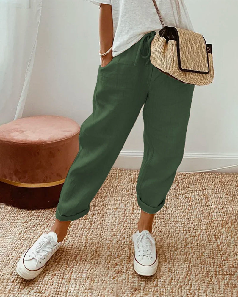 FJØRNA women's lightweight summer trousers with straight leg and high waist, shown in a neutral color on a model.