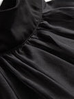 FJØRNA black chiffon high-neck sleeveless blouse for women, elegant tops with a flowy, stylish design.