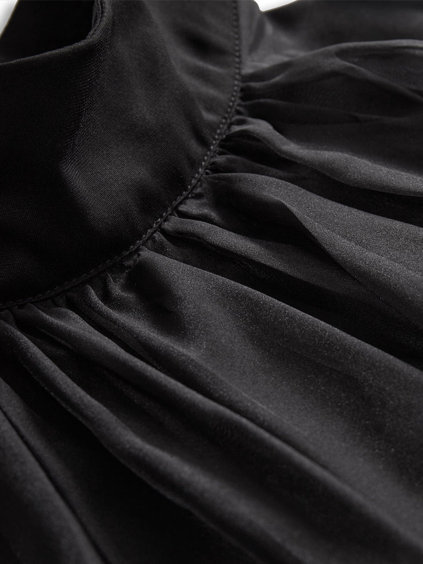 FJØRNA black chiffon high-neck sleeveless blouse for women, elegant tops with a flowy, stylish design.