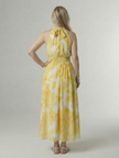 Flowy FJØRNA summer midi dress for women with halter neck and sleeveless design, perfect for warm weather and casual occasions.