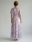 FJØRNA women's summer midi dress with floral print, square neckline, and flutter sleeves, perfect for warm-weather occasions.