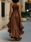 FJØRNA navy satin halter ruffle gown with elegant draping and a flowing silhouette, suitable for formal black-tie events.