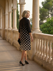 Elegant FJØRNA women's polka dot dress with pockets, suitable for evening wear, featuring a stylish and comfortable design.