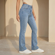 Women’s high waist slim fit bootcut jeans by FJØRNA, made of cotton denim, showing the stylish cut and classic blue denim fabric.