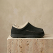 Men's soft slip-on slippers from FJØRNA with plush interior and casual design, ideal for cozy indoor wear.