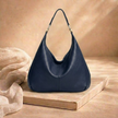 Large leather hobo bag for women by FJØRNA, stylish and spacious women's bag with a soft leather finish and casual design.