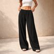 FJØRNA women's wide-leg drawstring lounge trousers with a loose fit and pull-on design, shown in a relaxed, casual style.