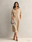 FJØRNA black linen midi dress, elegant evening dress with a flowing silhouette and simple design, suitable for formal occasions.