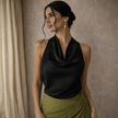 Cream satin sleeveless cowl neck top for women by FJØRNA featuring a mock neck and elegant draped design.