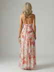 FJØRNA women's floral summer maxi dress with halter neck and sleeveless, flowing fabric, perfect for warm weather.