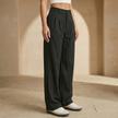 FJØRNA women's pinstripe high-waisted wide-leg trousers displayed on a model, showcasing tailored fit and stylish design