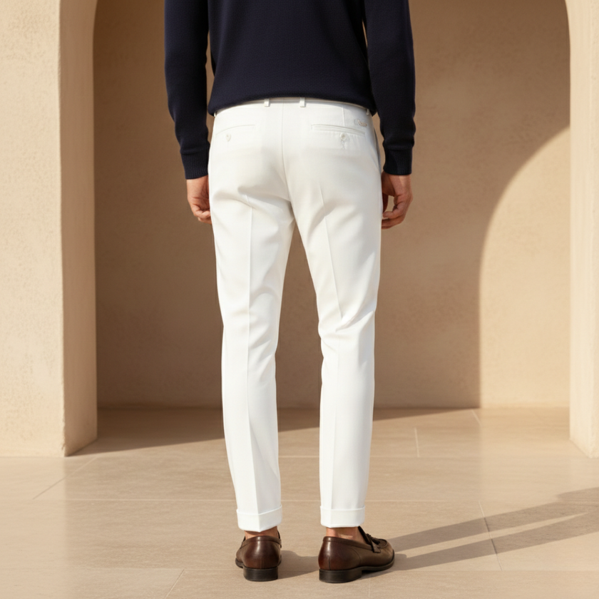 Men's slim fit ankle-length chinos by FJØRNA, tailored fit, in a neutral color, showcasing the pants laid flat.