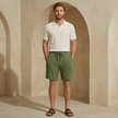FJØRNA men's textured drawstring relaxed-fit casual summer shorts displayed on a hanger.
