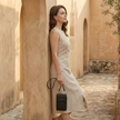 FJØRNA touchscreen crossbody phone bag for women, stylish bag with transparent phone pocket and adjustable strap.