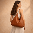 Large leather hobo bag for women by FJØRNA, stylish and spacious tote with shoulder strap, crafted from high-quality leather.