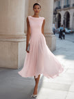 FJØRNA sleeveless pleated midi dress with draped neckline, ideal for wedding guests, showcasing elegant fabric and stylish design.