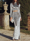 FJØRNA black long sleeve ruched cutout evening gown with elegant design, perfect for formal occasions and evening events.