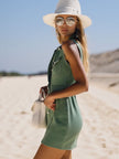 Green denim sleeveless mini dress for women by FJØRNA, featuring a fitted bodice and casual sleeveless design.