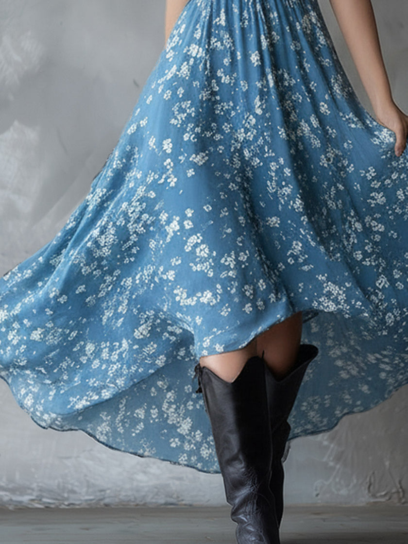 Navy blue chiffon floral maxi dress for women by FJØRNA, featuring a flowing design with floral patterns and a fitted waist.