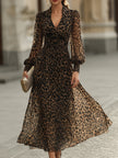 FJØRNA leopard print wrap midi dress with long sleeves, showcasing a stylish and fitted design on a model.