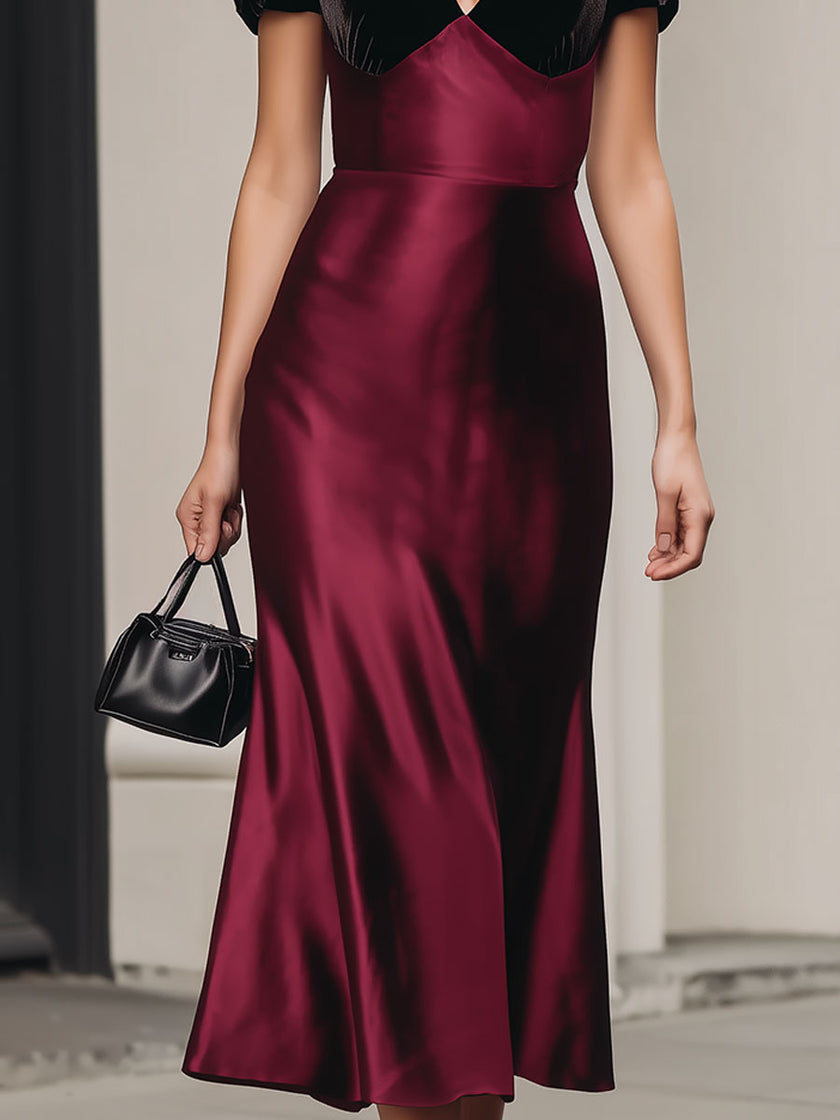 FJØRNA burgundy satin V-neck midi dress with velvet sleeves, elegant cocktail dress, showcasing its silky fabric and stylish design.