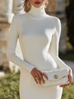 FJØRNA ribbed knit turtleneck mini dress with long sleeves, fitted and stylish for cold weather wear.