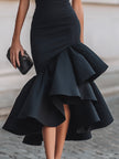 FJØRNA black asymmetric ruffle-hem midi dress with stylish ruffle details and sleek silhouette, perfect for elegant occasions.
