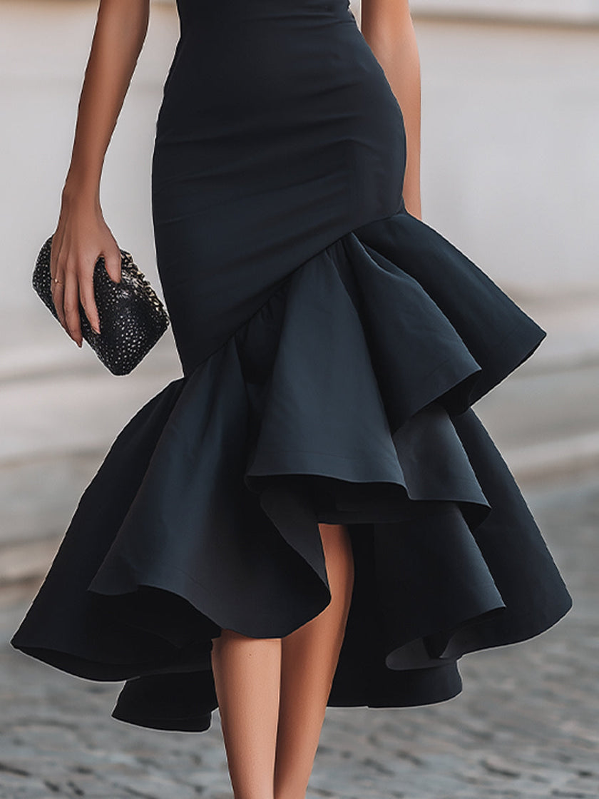 FJØRNA black asymmetric ruffle-hem midi dress with stylish ruffle details and sleek silhouette, perfect for elegant occasions.
