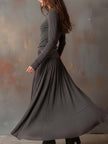 Charcoal knit maxi dress for women by FJØRNA, featuring a long, flowing design with a comfortable textured knit fabric.