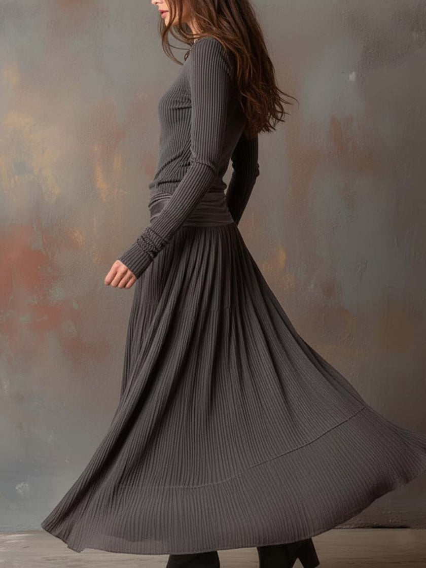 Charcoal knit maxi dress for women by FJØRNA, featuring a long, flowing design with a comfortable textured knit fabric.