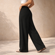 FJØRNA women's wide-leg drawstring lounge trousers with loose fit and pull-on design, perfect for comfortable casual wear.