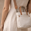 FJØRNA large canvas messenger bag for women, stylish shoulder bag with adjustable strap and spacious interior for everyday use.