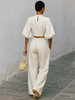 Cream textured lantern sleeve two-piece set for women featuring pants, from FJØRNA, shown on a model.