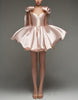 Light pink satin cocktail dress for women with sweetheart neckline, corset fit, and bow detail by FJØRNA.