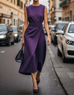 FJØRNA women's midi dress featuring a round neck, sleeveless design, and pleated fabric for a stylish, elegant look.