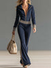 Dark blue knitted hooded zip-up V-neck jumpsuit for women by FJØRNA, featuring a comfortable fit and stylish design.