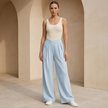 Women's FJØRNA criss-cross waist wide-leg trousers, loose pull-on pants with a relaxed fit and comfortable design.