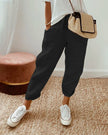 FJØRNA lightweight summer women's trousers with straight leg fit and high waist, shown on a model in a casual setting