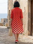 FJØRNA women's summer dress with polka dots and pockets, lightweight and stylish for warm weather wear.