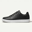Men's leather lace-up low top sneakers by FJØRNA featuring black leather uppers and white rubber soles.