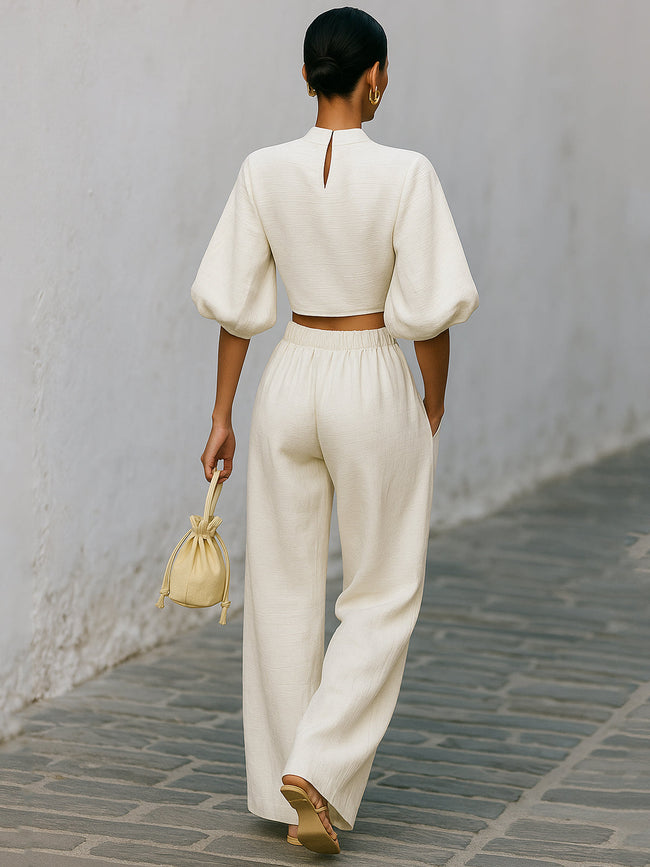Cream textured lantern sleeve two-piece set for women featuring pants, from FJØRNA, shown on a model.
